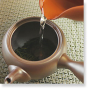 how to make green tea : poor water into the pot over the loose tea and let brew
